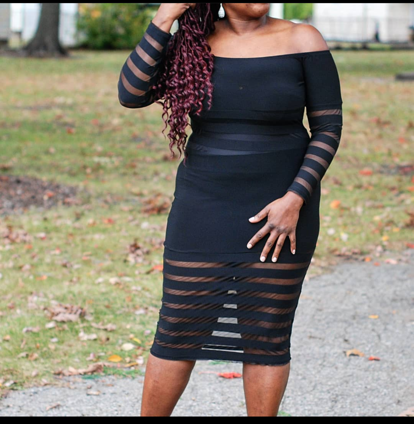 The black off-shoulder Arie panel dress.  Turn heads with the alternating strips of black sheer panels going down this dress.  The middle, bottom, and arms of the dress has the sheer panels.   Made in the U.S.A. of 96% polyester and 4% spandex.  The Arie has just enough stretch you need to lay over your curves.   Don't be afraid to cover the mid section of the dress with under garments it necessary.  The Arie will give you the look to take over an event.
