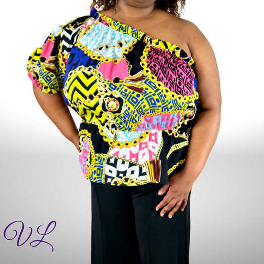 The Alisha is a one shoulder multi colored peplum style  top.  With a short sleeve on the right side.  This top is a pullover design made in the U.S.A. of 100% polyester.  The top has just enough color to add to any outfit. Get noticed without even trying in the Aisha top.