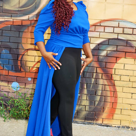 The high-low Alicia top is a pull over top that has a long skirt attached to the back at the waist.  It has slightly puffed sleeves that are three quarters length with plenty of arm room.   Made in the U.S.A. of 95% polyester and 5% spandex.  This top runs true to size.  You can pair this royal blue top with pants or a skirt